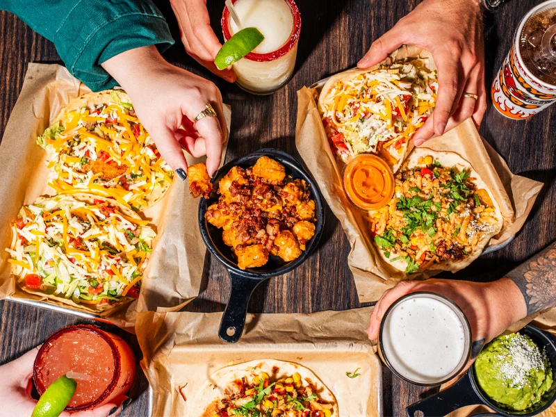 A spread of tacos and drinks from Torchy's Tacos